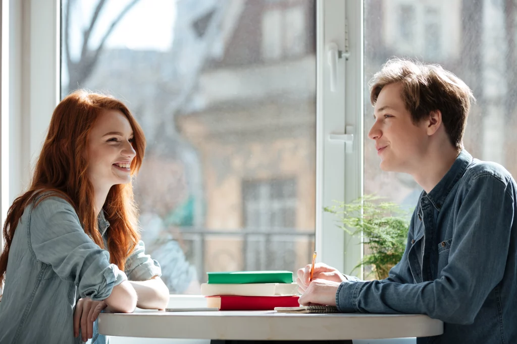 two students talking cafe